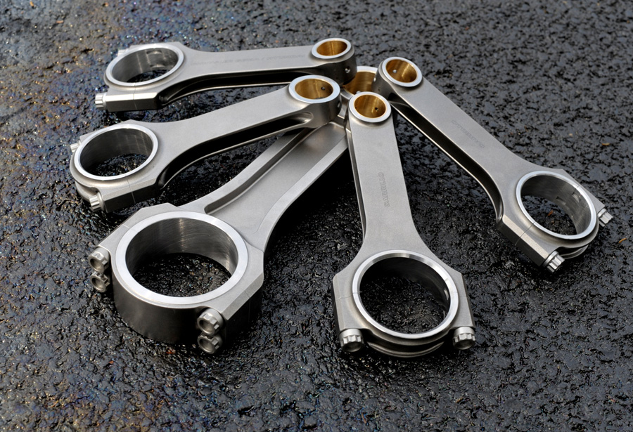 connecting rods arranged on asphalt
