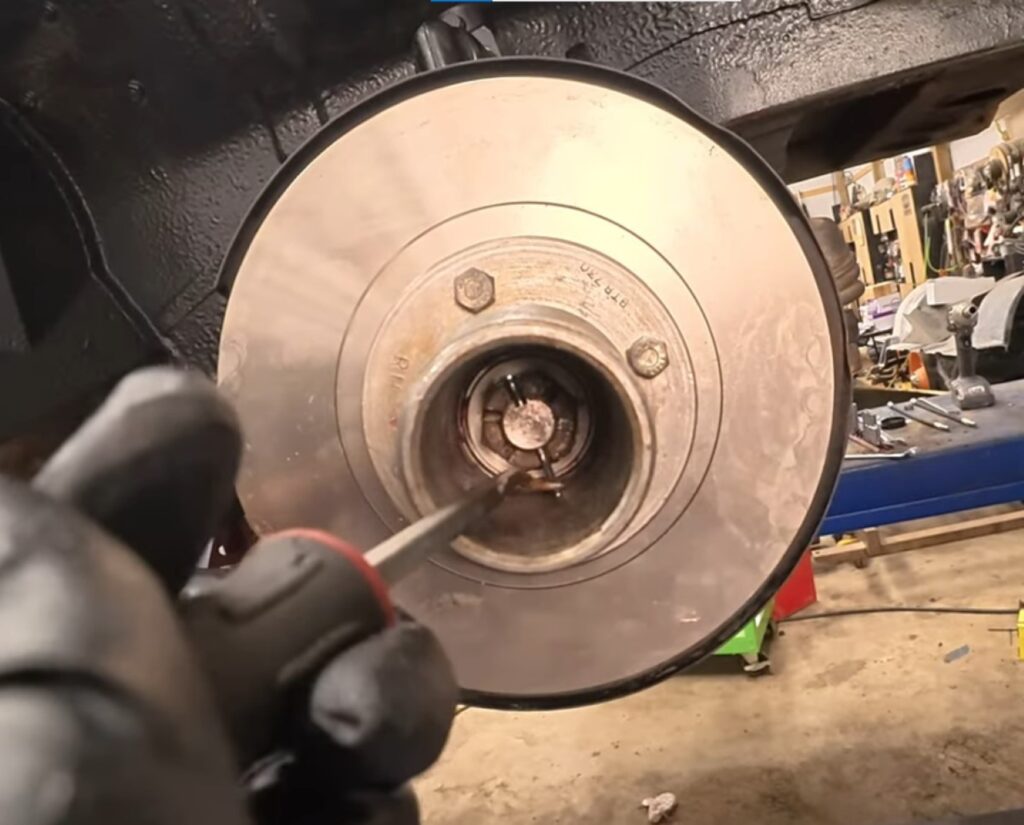 Installing cotter pin in castle nut on an MGB GT's front hub