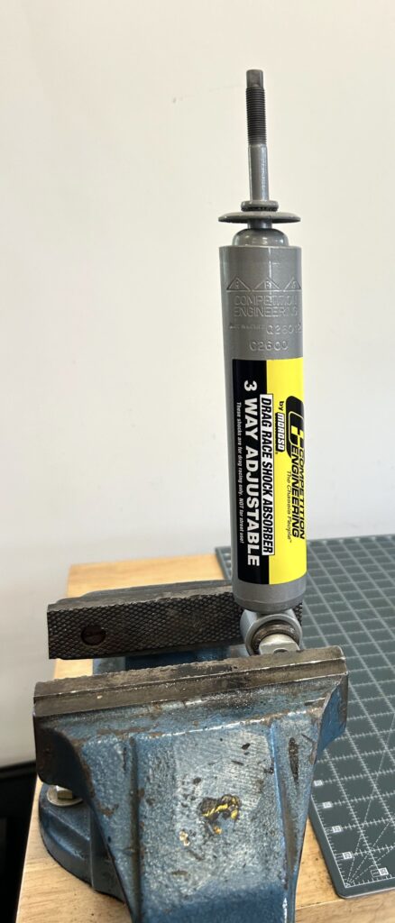 Competition Engineering shock in a vise