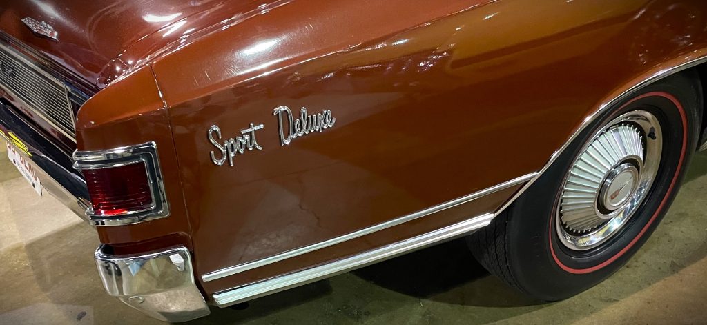 Sport Deluxe Fender emblem on a Canadian Chevy Acadian